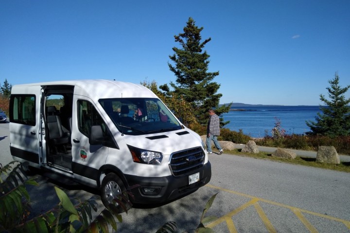 a truck driving down a dirt road