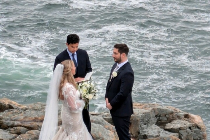 a couple of people that are standing in the water