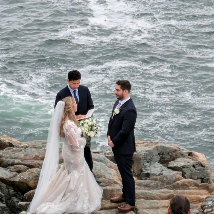 a couple of people that are standing in the water