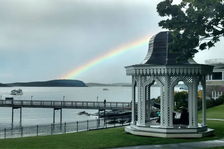 a rainbow over a body of water