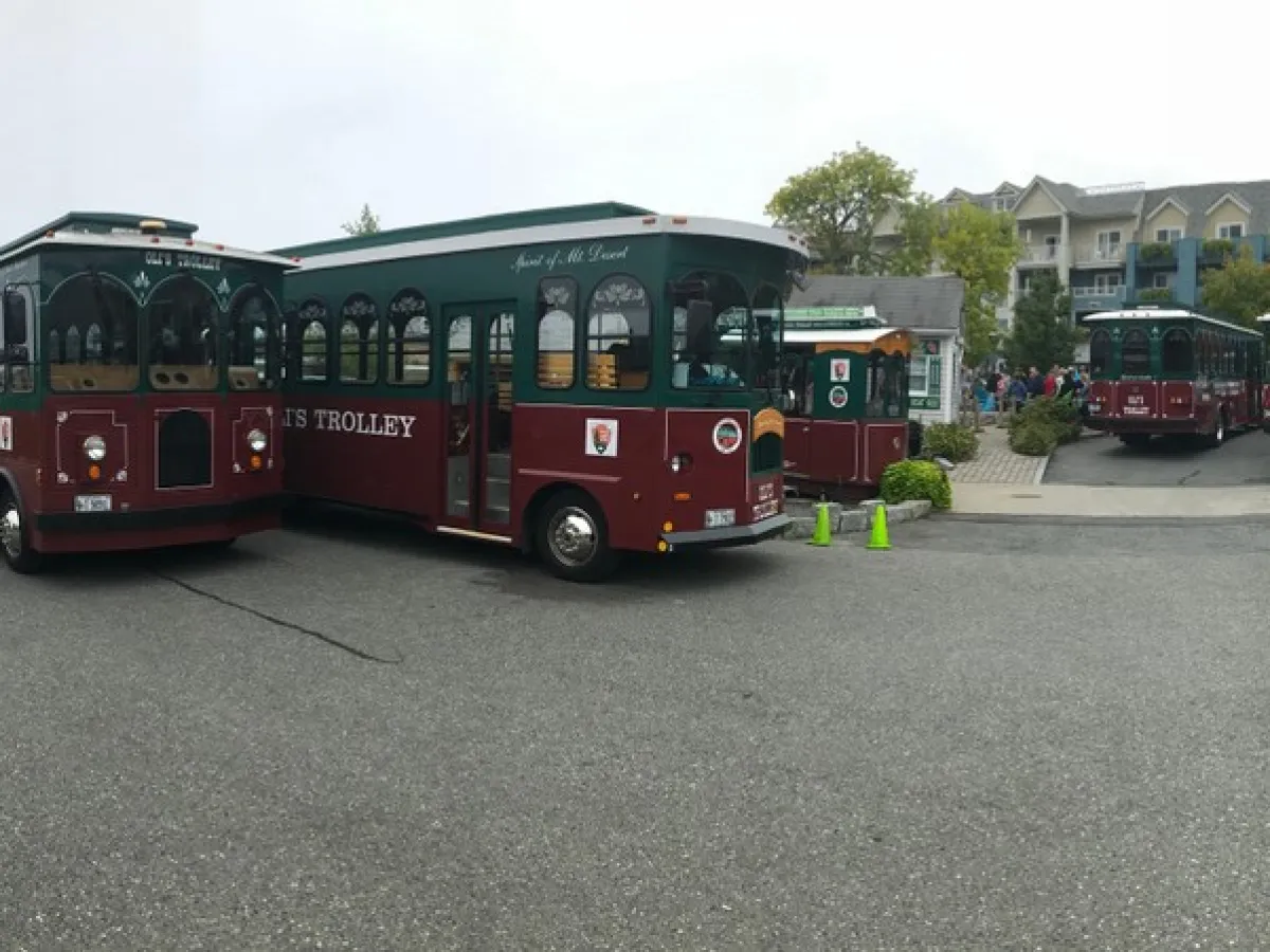 a passenger bus that is parked on the side of a road
